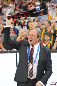 Sheedy with his famous scarf waving , starts the Bombers faithfull before the game