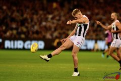 100 gamer Adam Treloar shoots and scores against the old enemy.