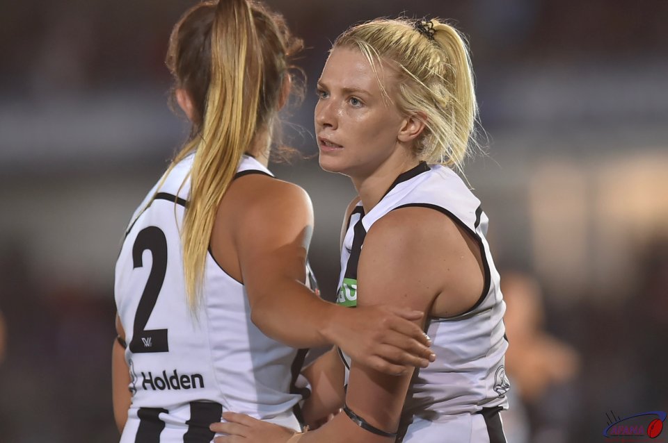 Chloe Molloy (2) and Kristy Stratton comfort each after another opening loss to Carlton