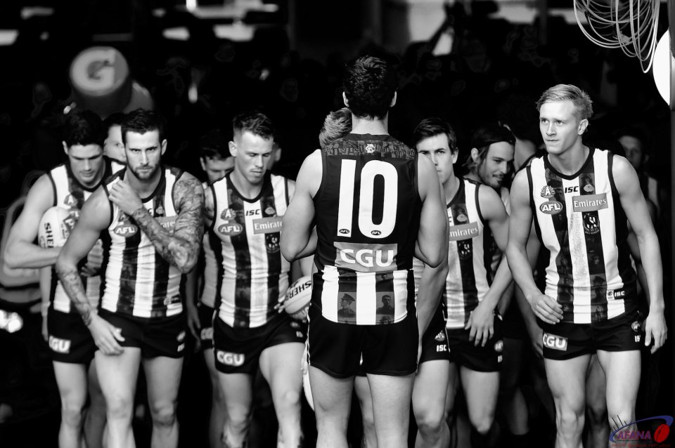 The Pies form up in the players race before the game