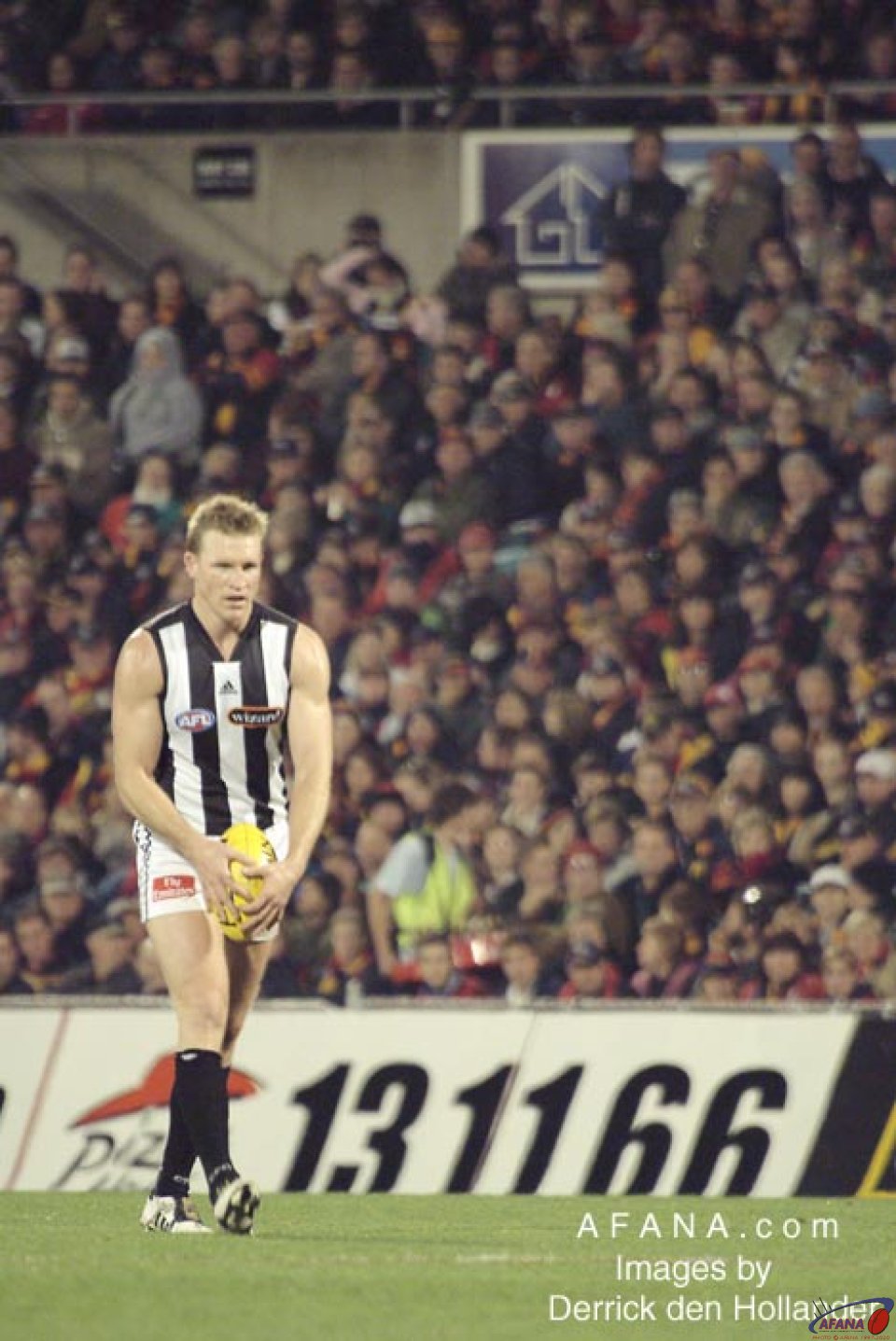[b]Collingwood captain Nathan Buckley attempts a shot on goal[/b]