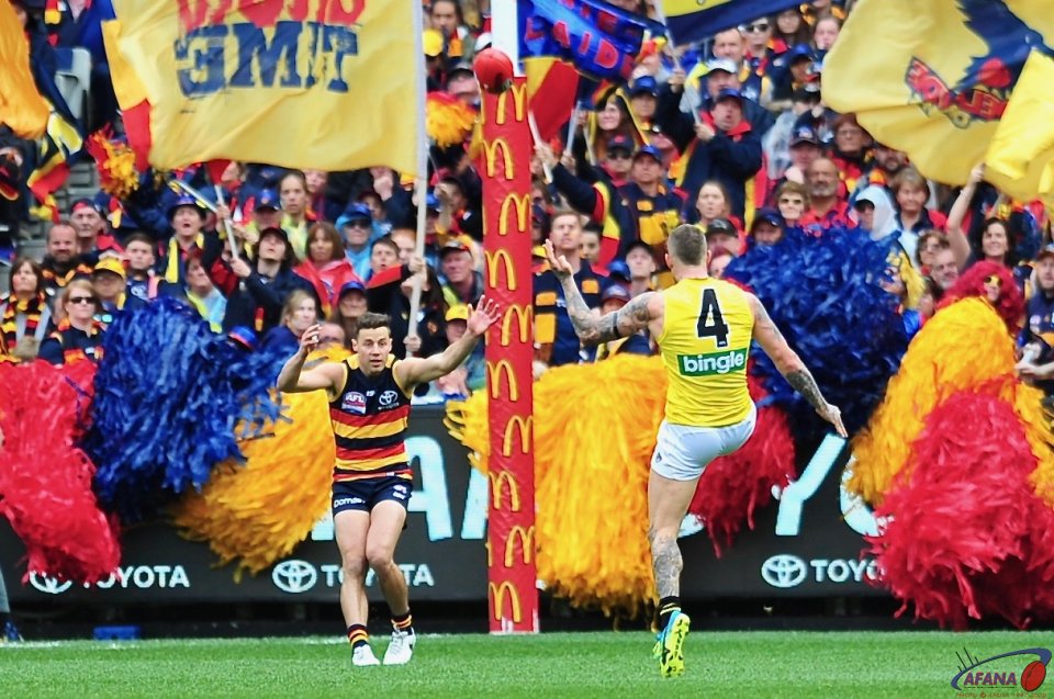 Dustin scores in front of the Crows Cheersquad.