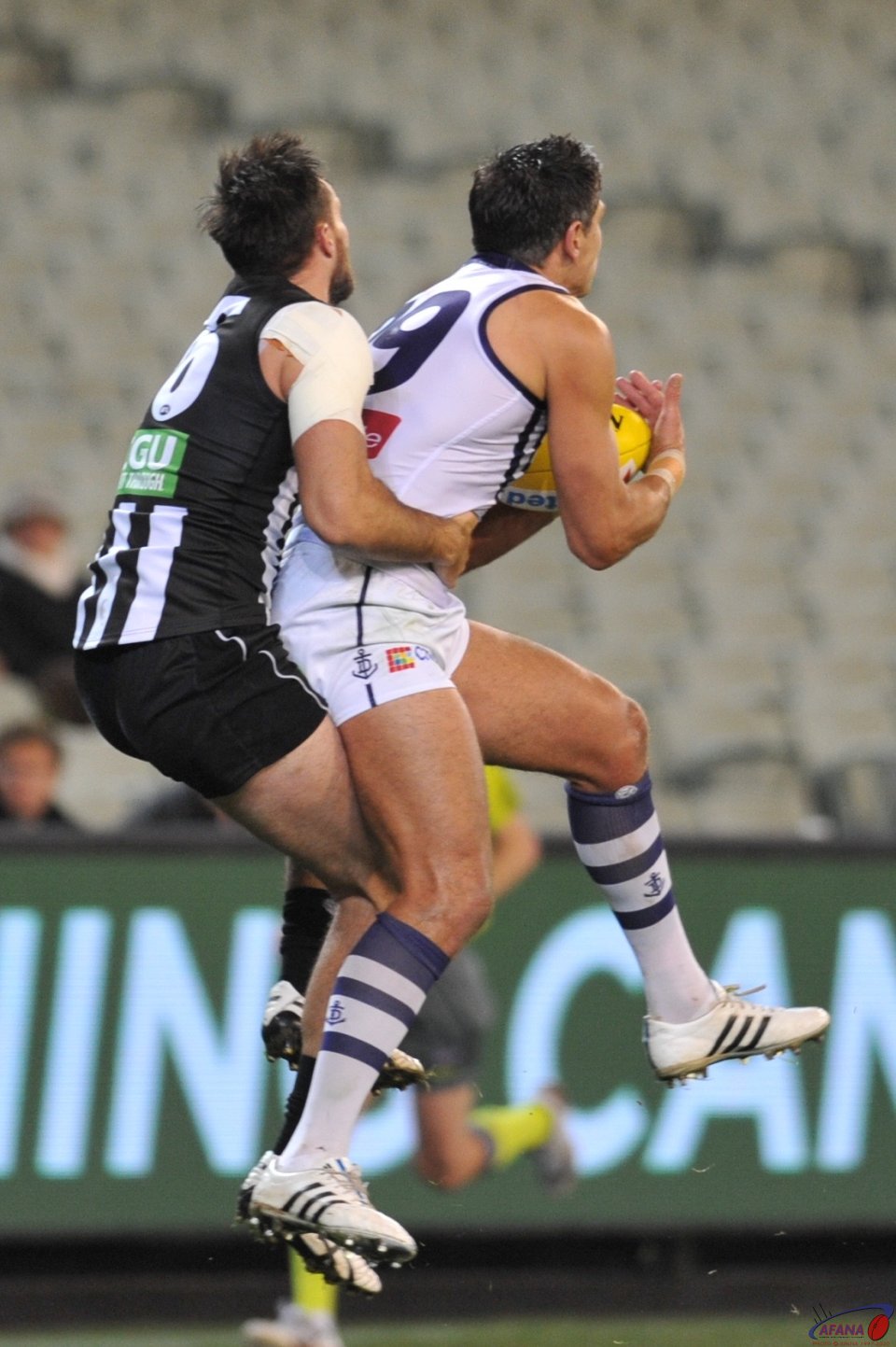 Matthew Pavlich playing his last game on the MCG, marks in front of Nathan Brown