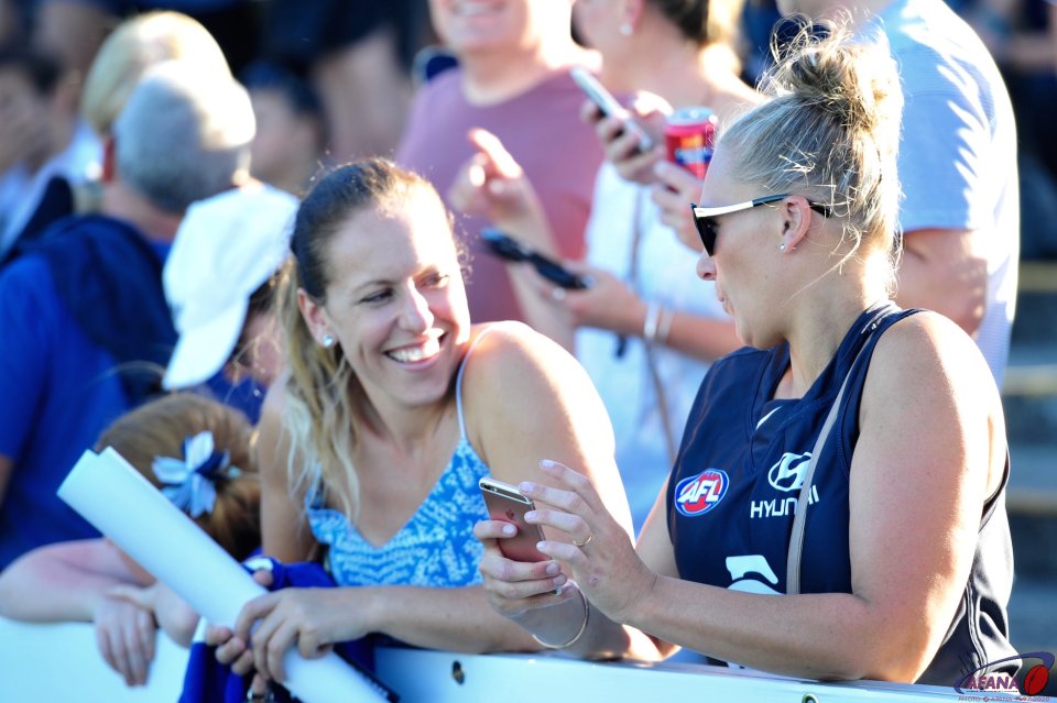 Carlton supporters enjoying the balmy Melbourne weather at the first AFLW match between the Blues and the Pies