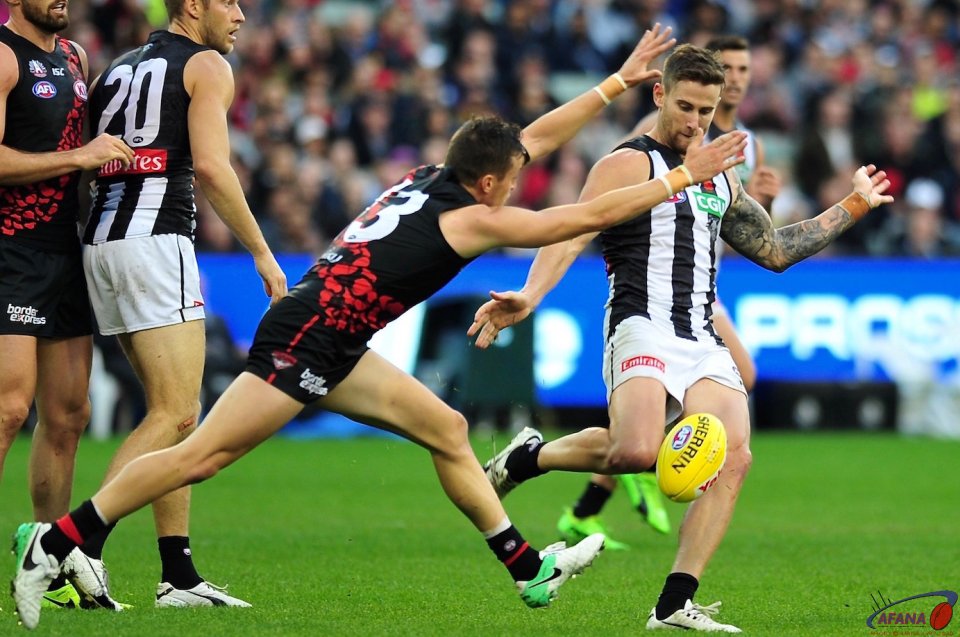 Ramsay clears as Fantasia keeps the forward pressure on the Pies defenders
