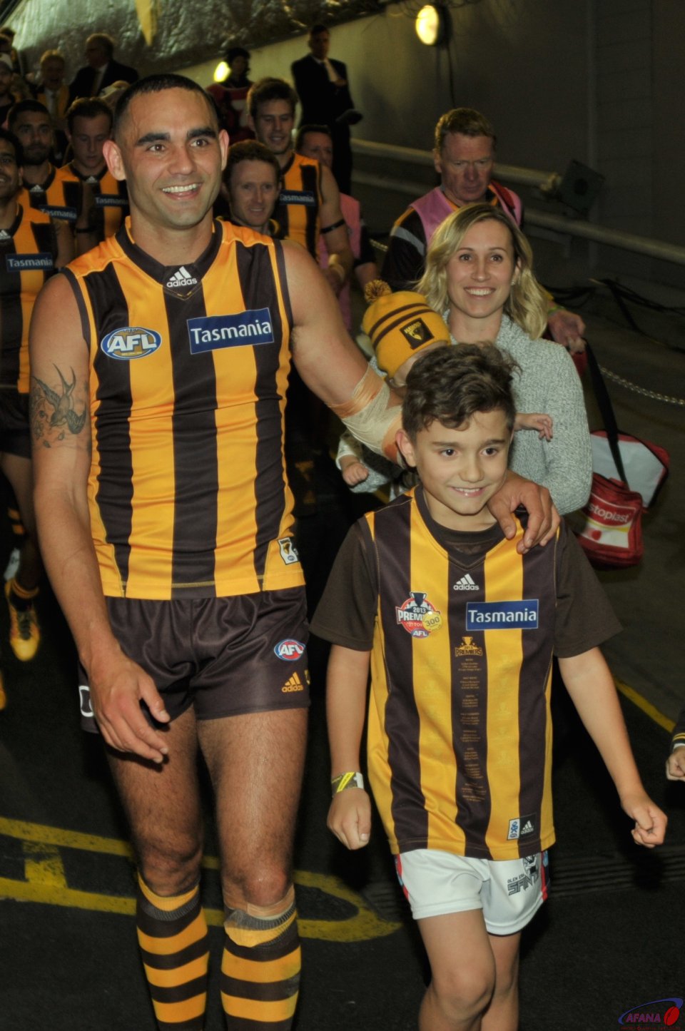 A jubilant Shaun Burgoyne walks down the race with his son and wife after a ggreat come from behind win 