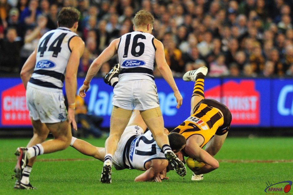 Menegola (27) and Schoenmakers (25) clash as Scott Selwood and Corey Enright watch and wait