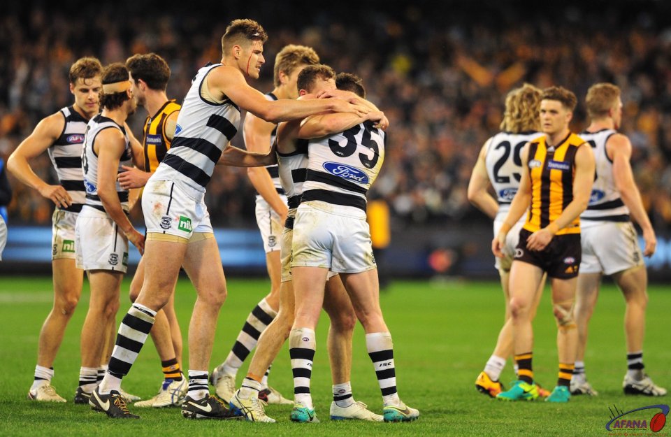 Selwood and Dangerfield embrace as Zac Smith joins in