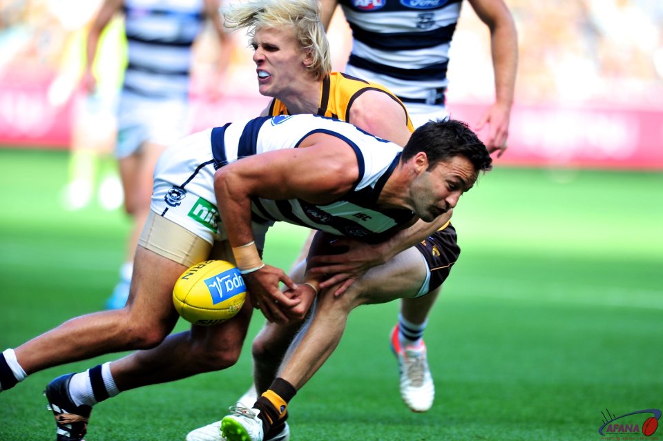 Will Langford stops Jimmy Bartell in his tracks as the Cats attempt a center clearance.