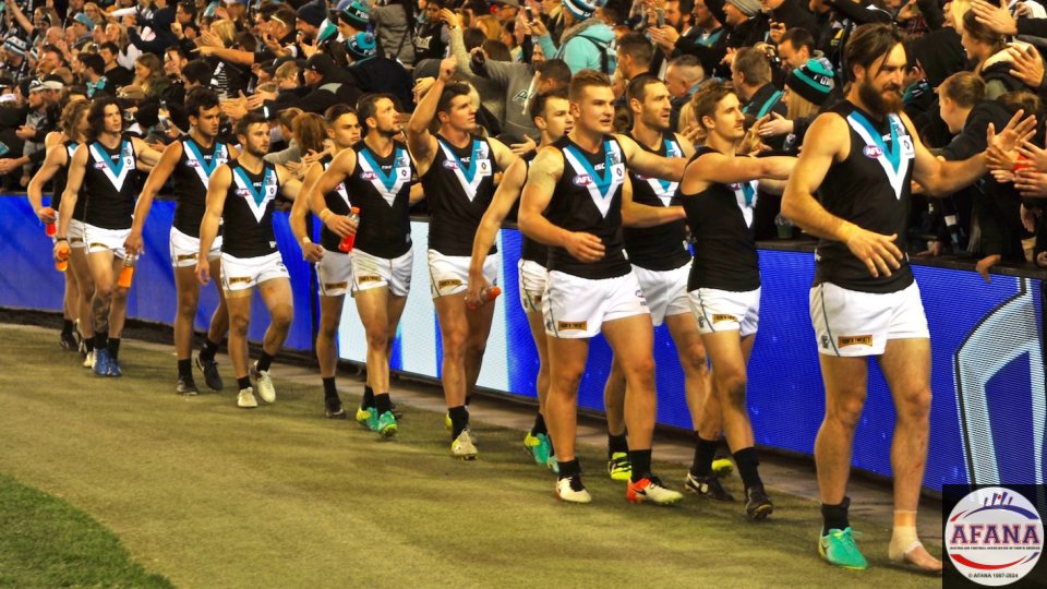 The Power boys thanks their travelling fans after defeating North Melbourne