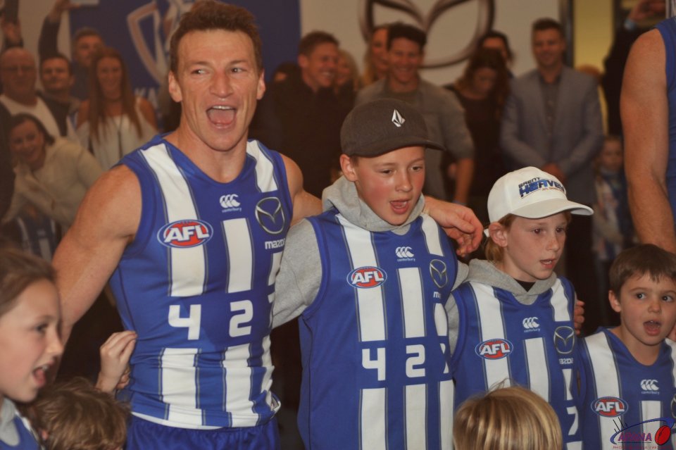 Brent Harvey and his family belt out the North Melbourne song in the rooms after the game