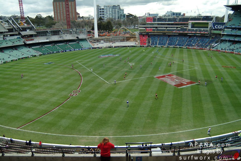 The Melbourne Cricket Ground viewed from the stands.  The portion under reconstruction visible in the distance.