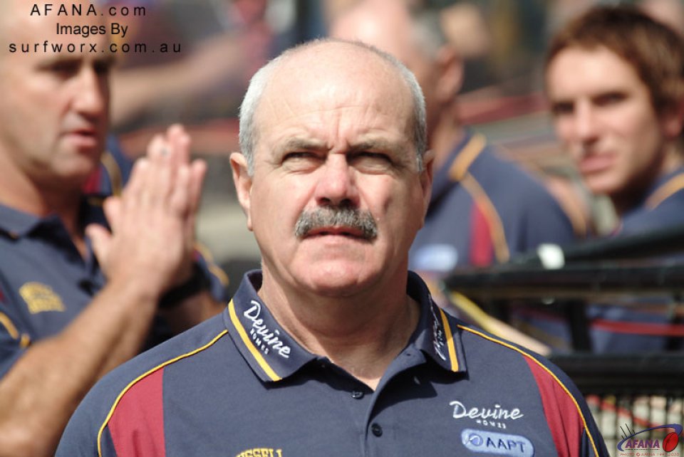 Leigh Matthews, coach of the Brisbane Lions, leaves the dressing rooms and enters the MCG.