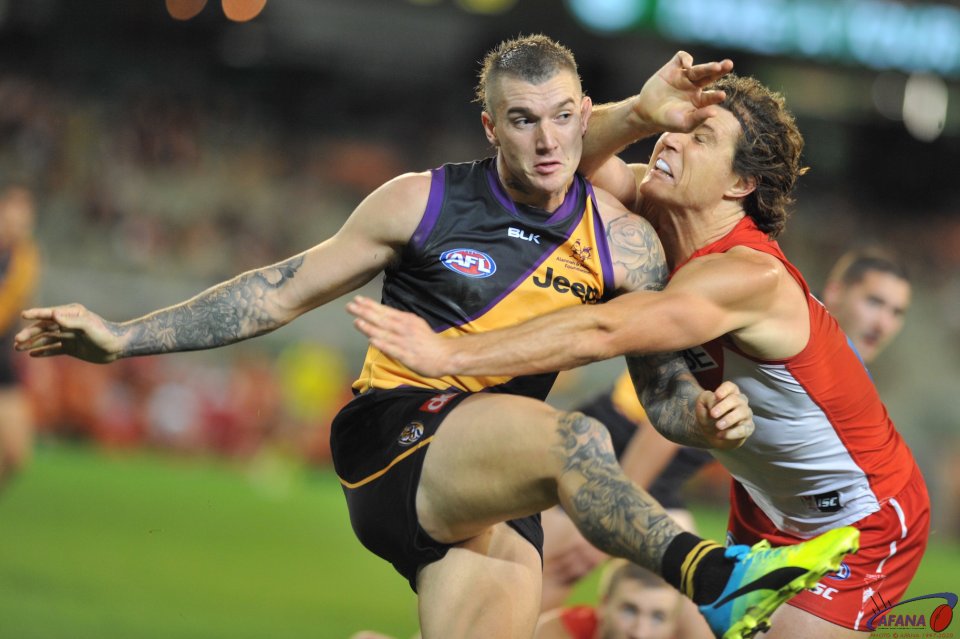 Dusty clears the ball as Tippett tackles