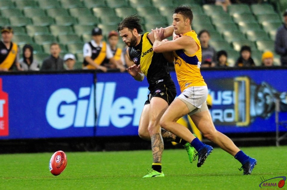 Ben Lennon in the forward procket for the Tigers is under pressure from the Eagles defence