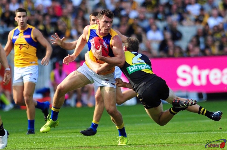 Luke Shuey is tackled by Dylan Grimes (2)
