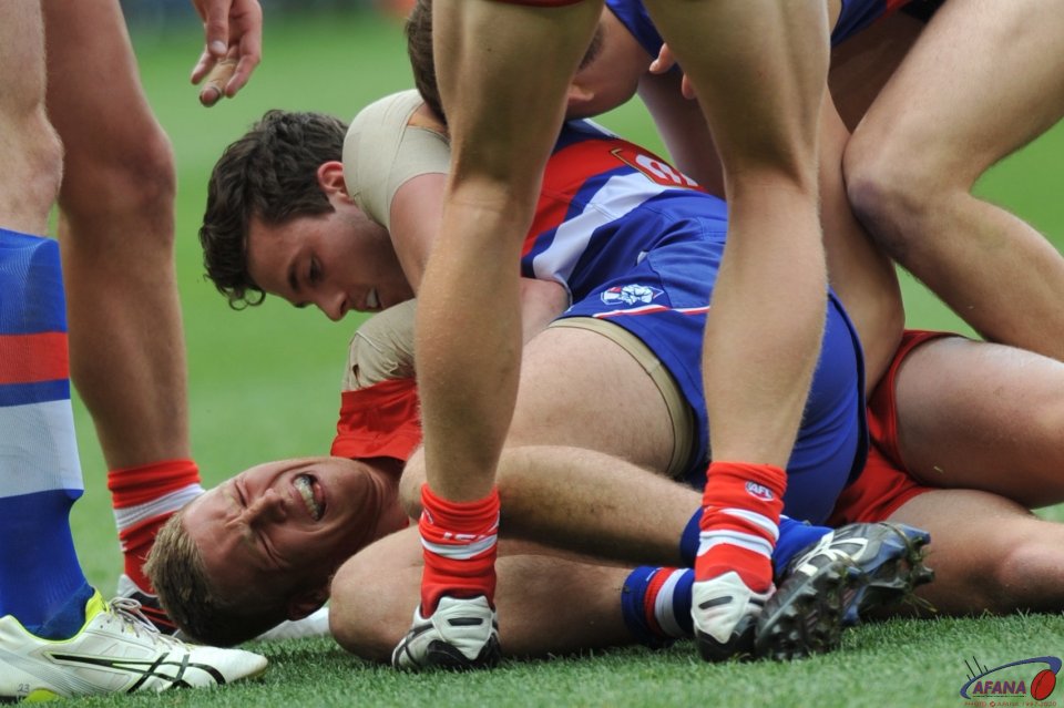 Hannebury feels the pressure and pain from Zane Cordy's hard tackling
