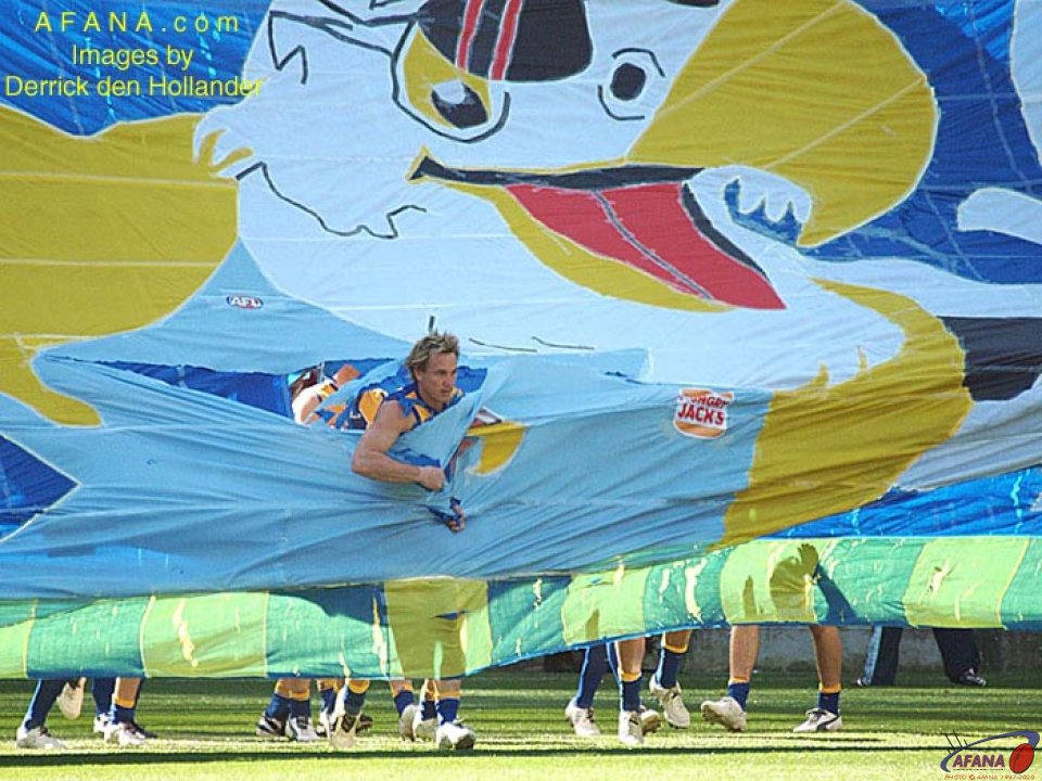 [b]The West Coast Eagles about to run through their match day cheersquad banner[/b]