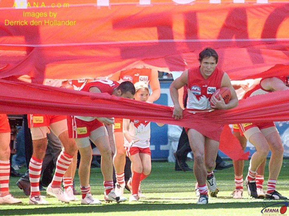 [b]The Sydney Swans about to run through their match day cheersquad banner[/b]
