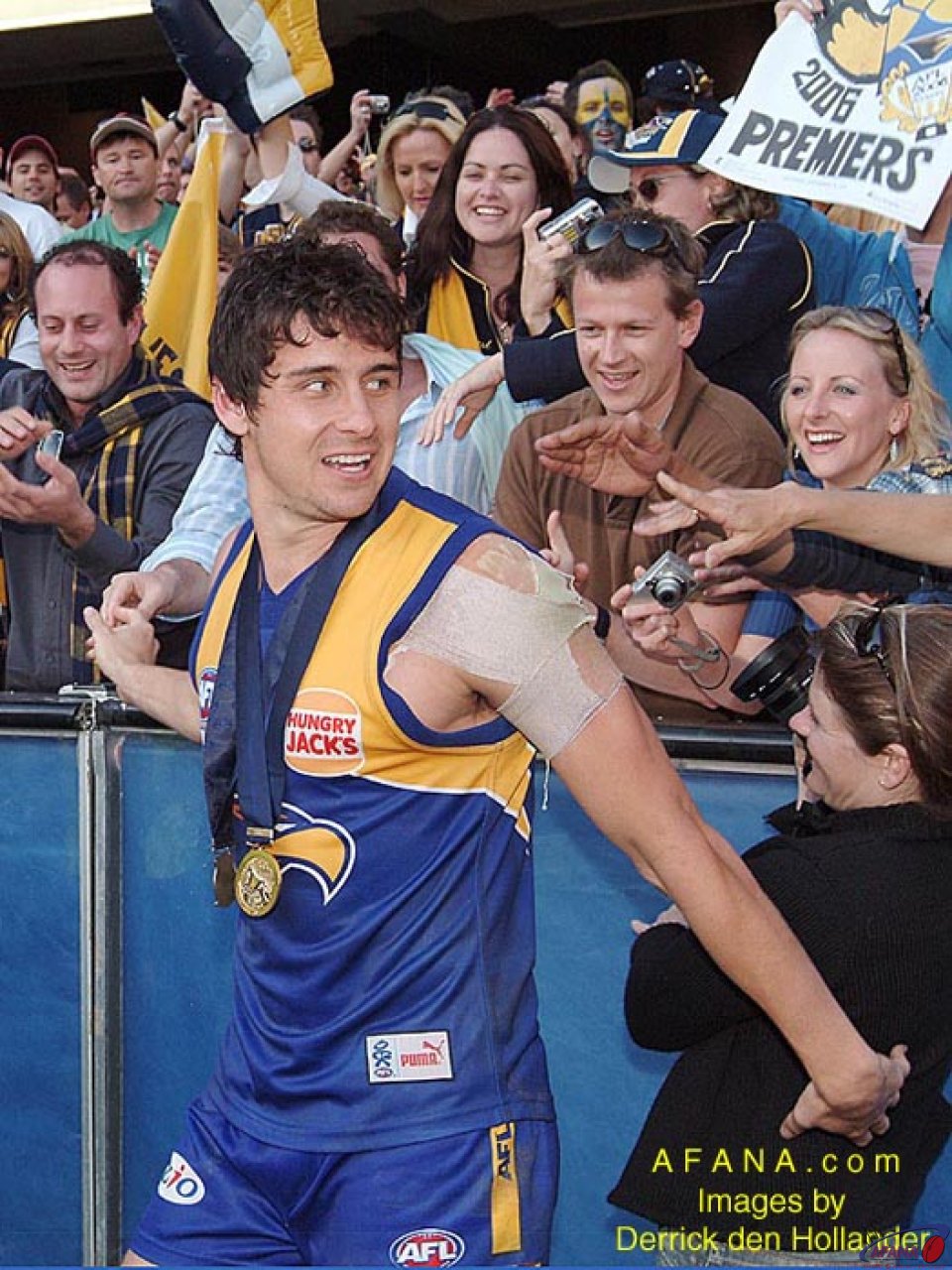 [b]Norm Smith Medallist Andrew Embly continues his team's lap of honour[/b]