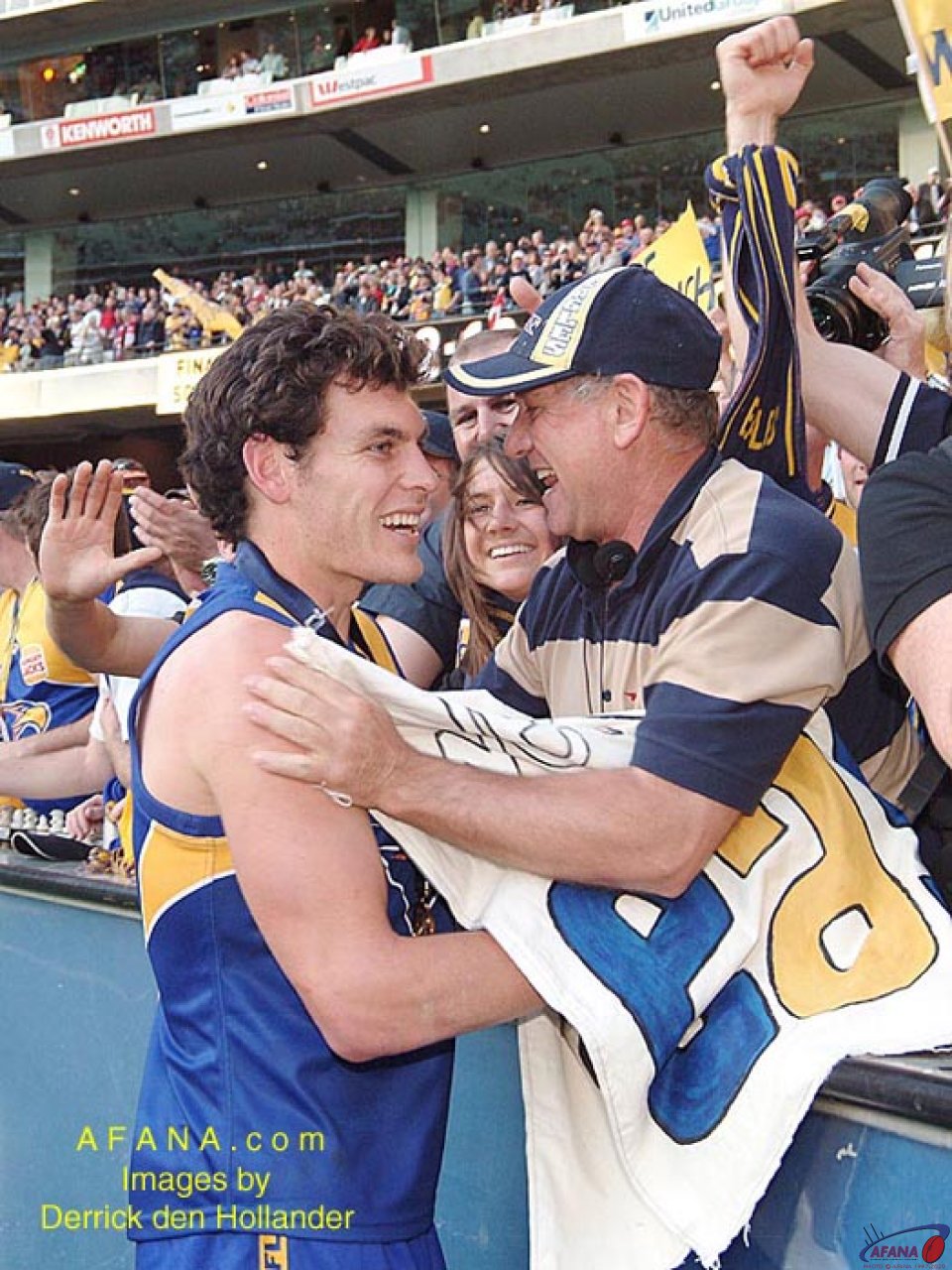 [b]A west Coast Eagles player is congratulated by family and friends on the teams victory lap[/b]
