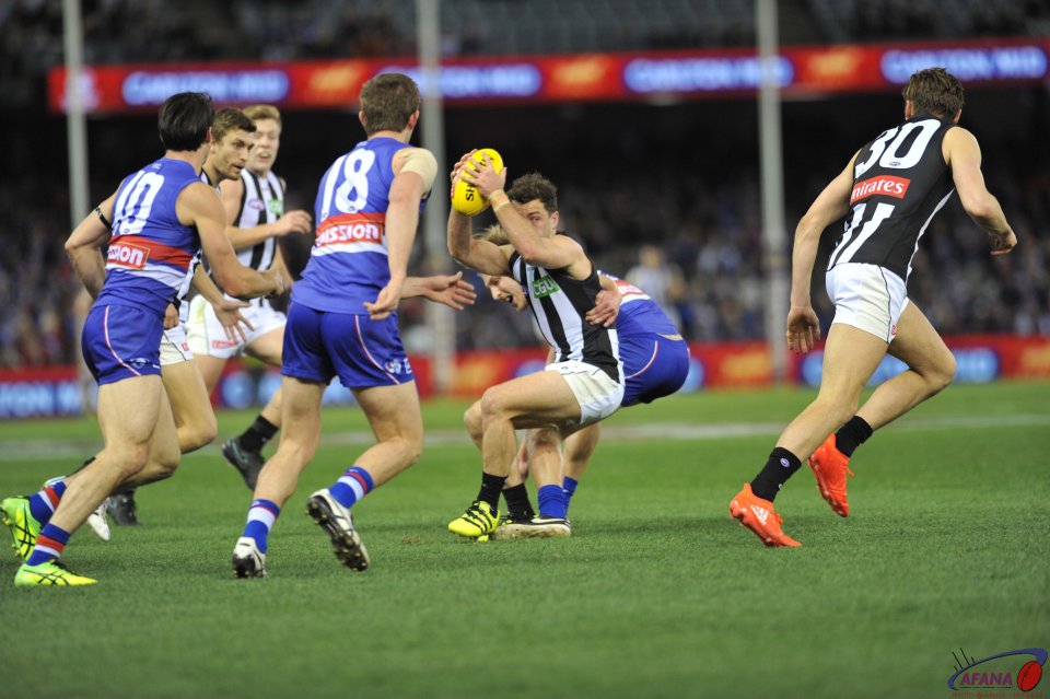 Bulldogs stop another Magpie attack as Jarryd Blair attempts to evade a tackle