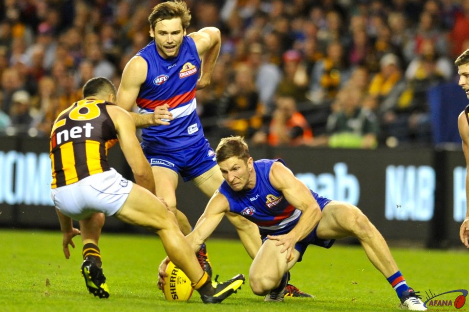 Matthew Boyd picks up the loose ball as Paul Puopolo arrives