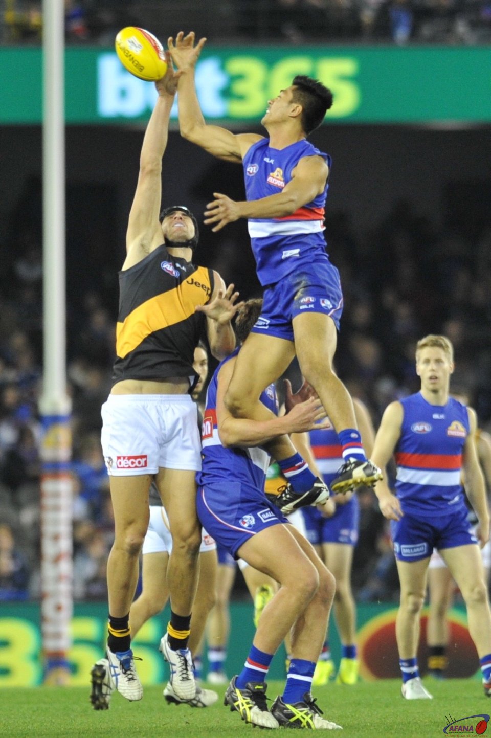 Lin Jong gets serious air against the tall Tigers ruckman