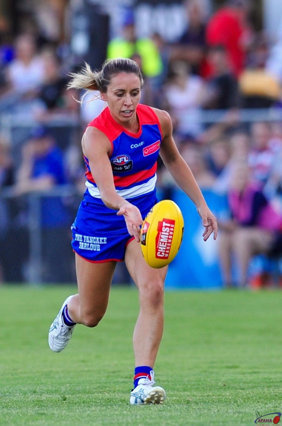 Laura Bailey taps the ball out of defence