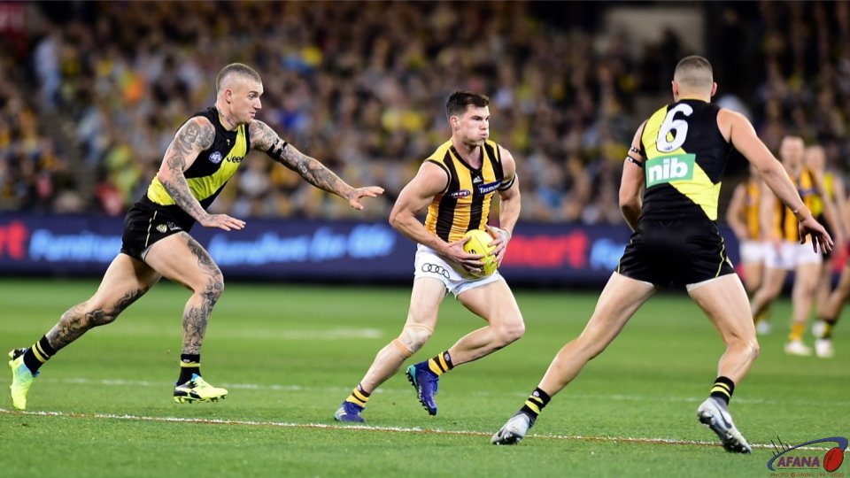 Dustin Martin chases Jaeger O'Meara