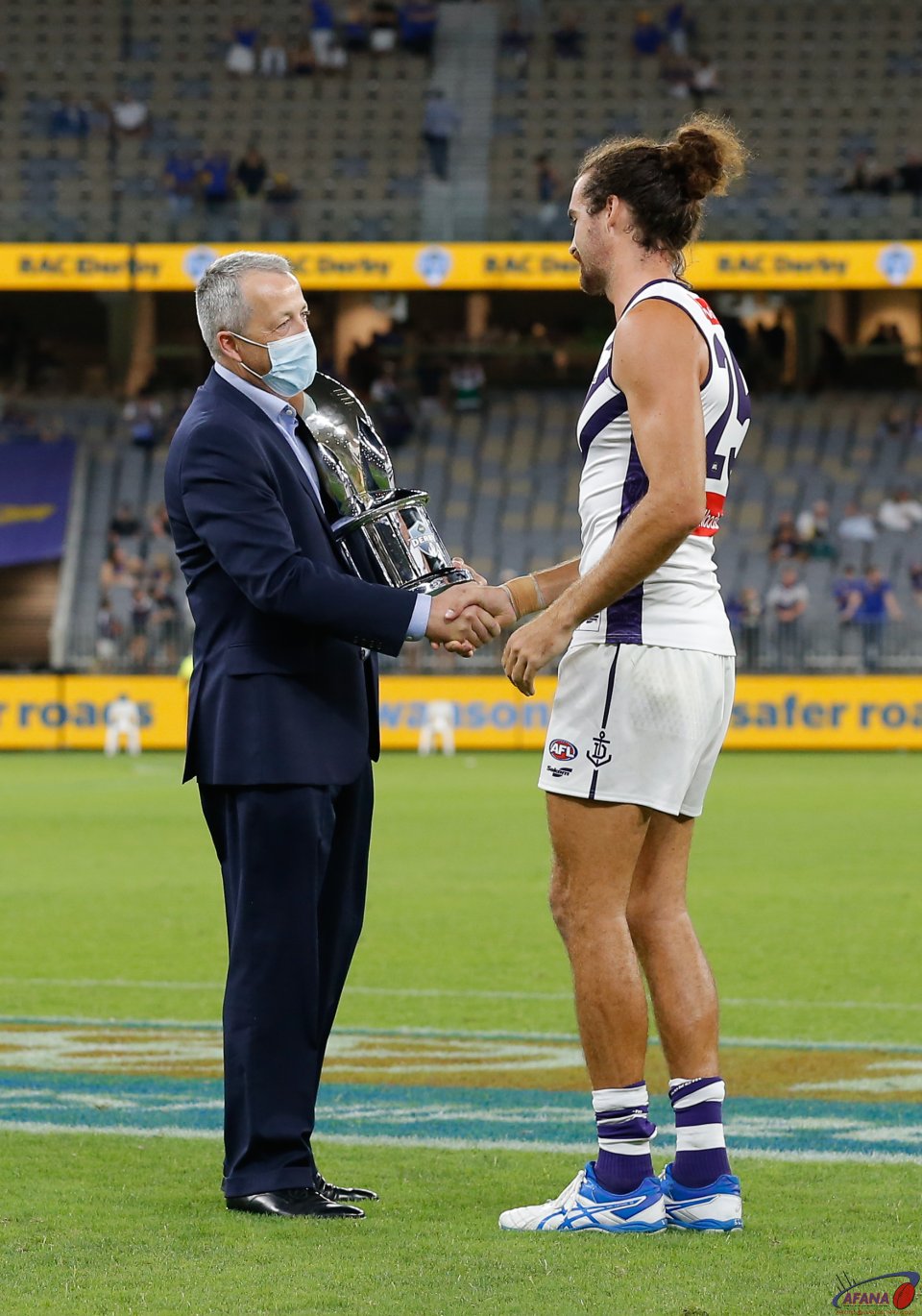 Alex Pearce accepts the trophy