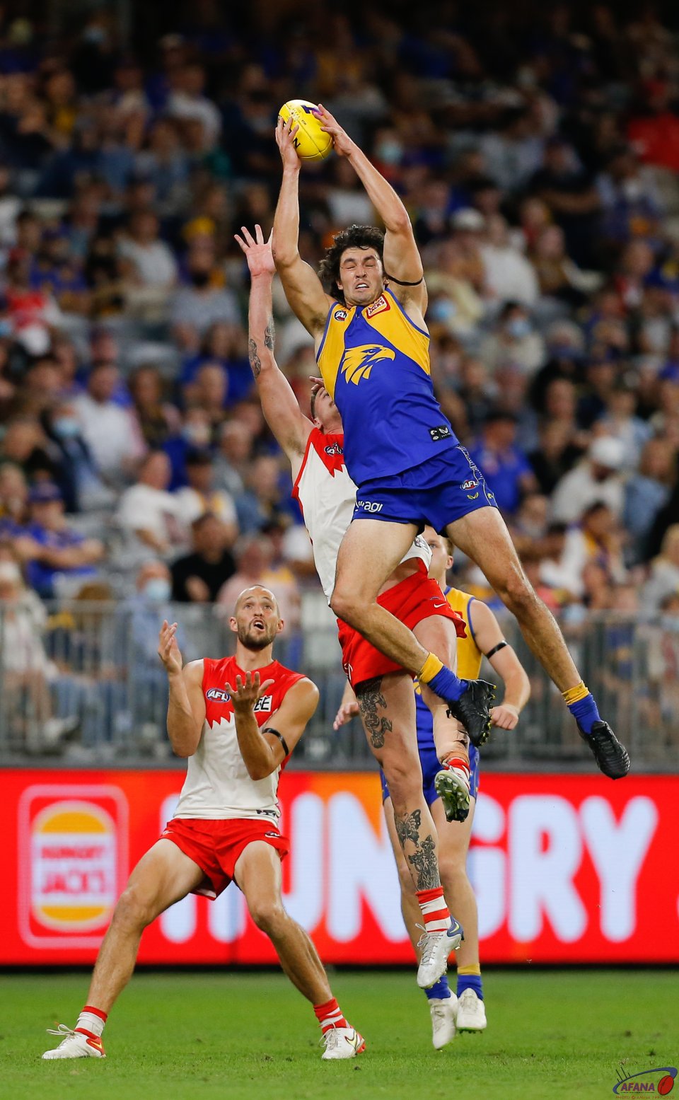 Giant leap from Tom Barrass