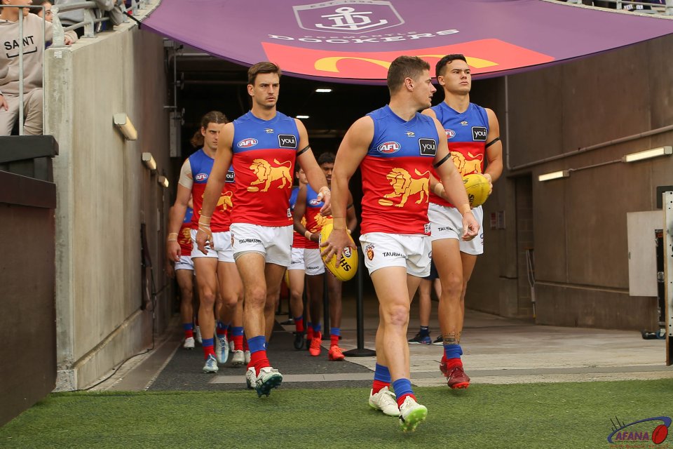 Dayne Zorko leads the Lions out