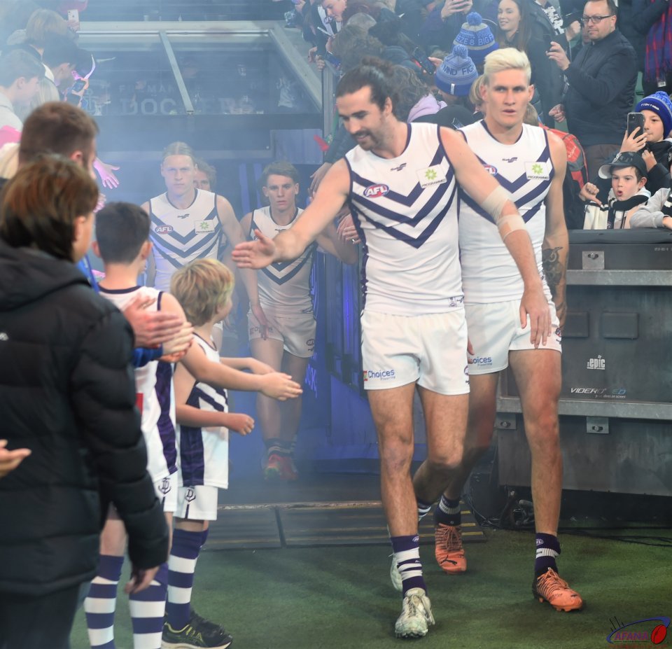 Fremantle players enter the playing field