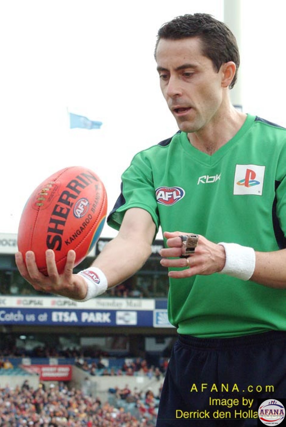 [b]A Field Umpire prepares to throw the ball back into play at a boundary stoppage[/b]