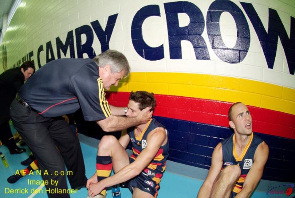 [b]Adelaide Crows coach Neil Craig congratulates each player after the game against the Dockers[/b]
