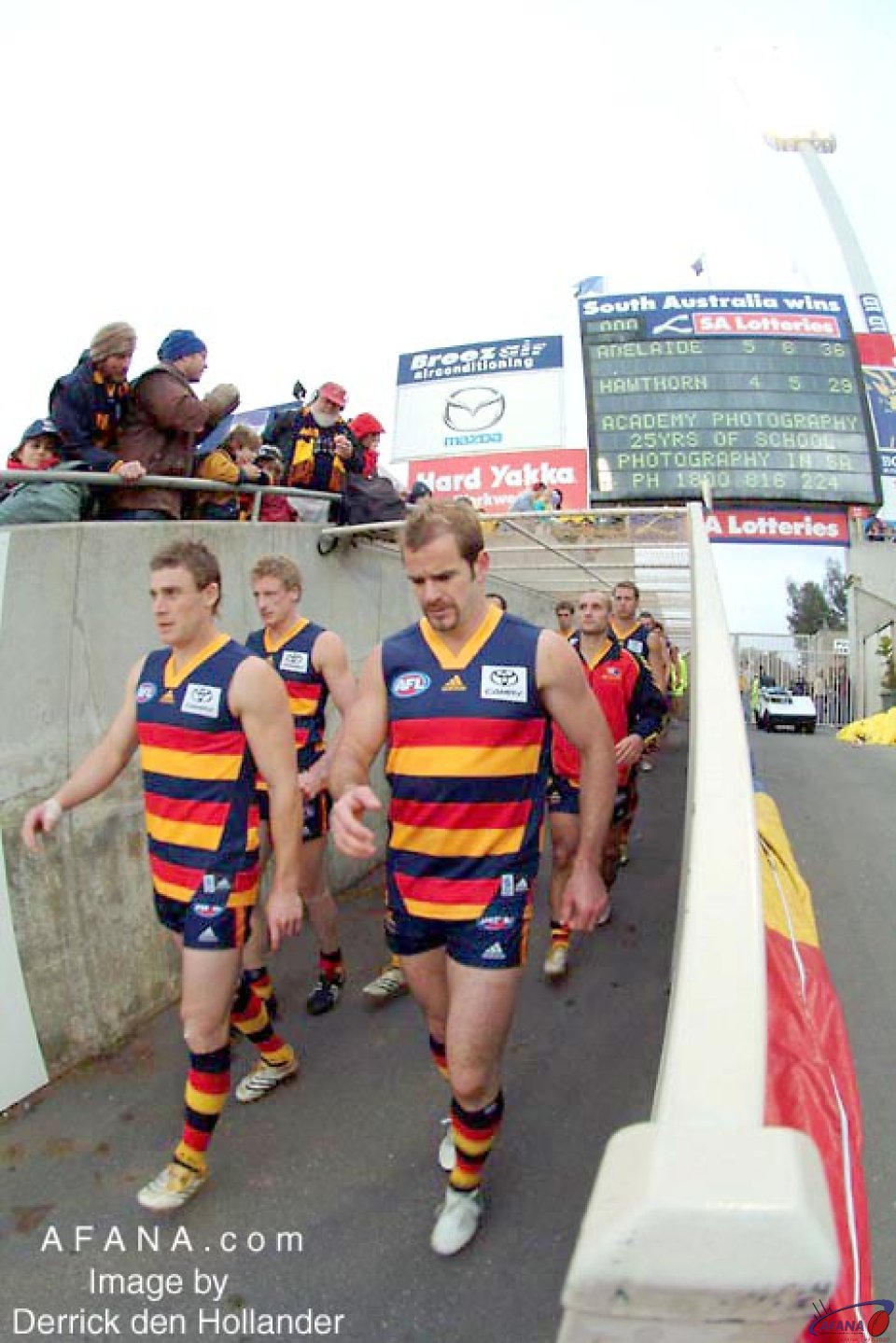 [b]Mark Riciutto and Simon Goodwin lead the Adelaide Crows out onto the ground[/b]