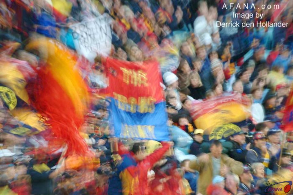[b]A combination of slow shutter and zoom lens illustrate the colour of AFL football fans[/b]