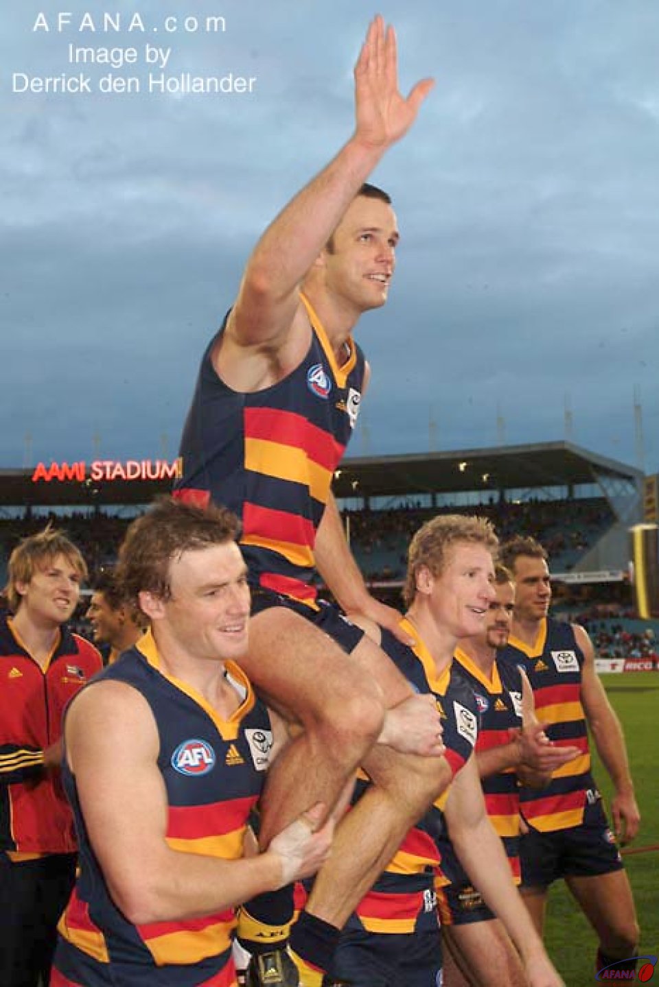 [b]Kris Massie is chaired from the ground, celebrating 100 games AFL games[/b]