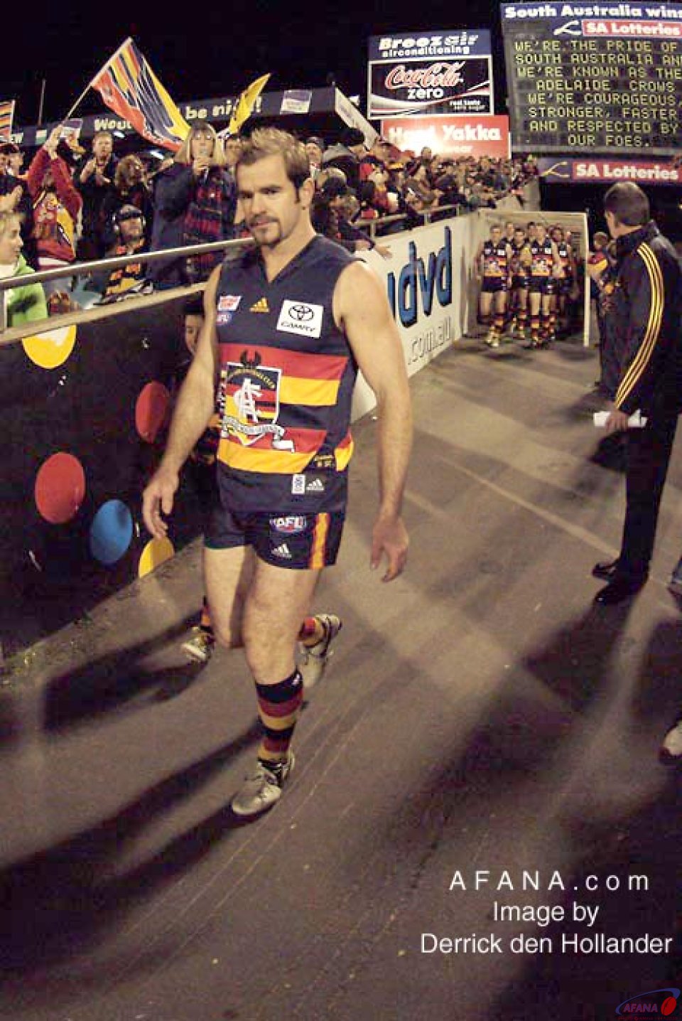[b]Adelaide Crows captain, and Brownlow Medallist Mark Riciutto leads the players onto the field in his 300th game.[/b]