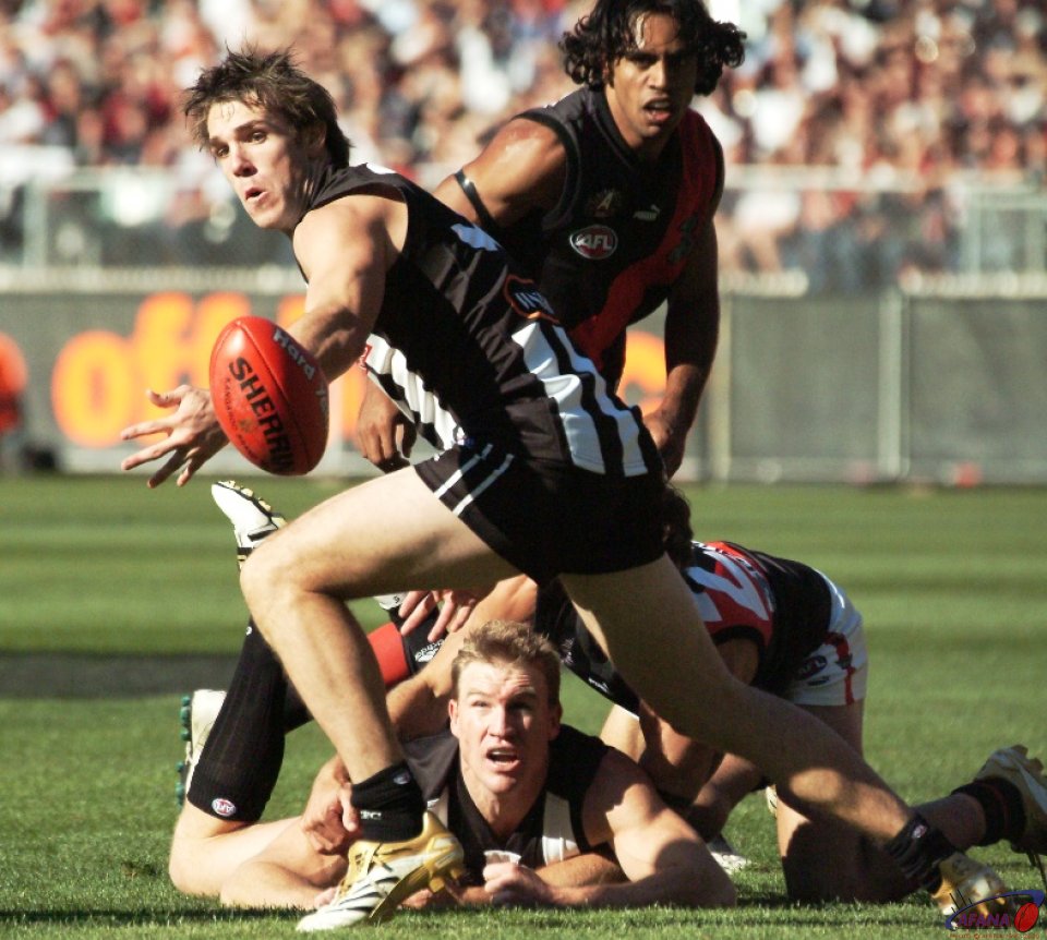 [b]Collingwood captain Nathan Buckley spills the ball forward for the Magpies[/b]