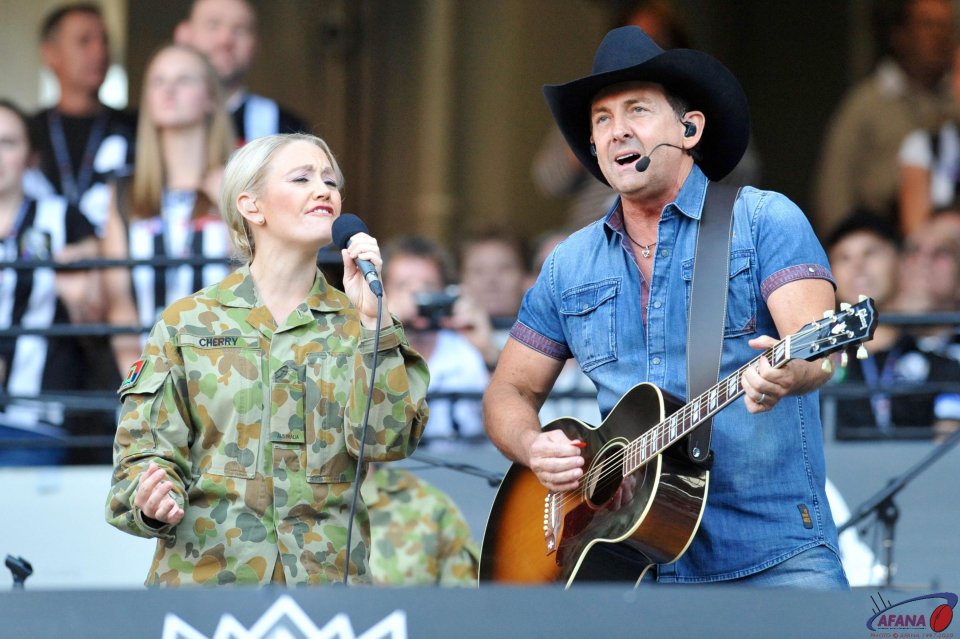 Australian Country music legend Lee Kernaghan sings with the army band
