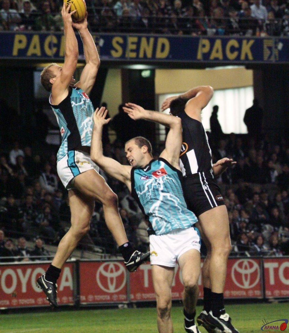 [b]Port Adelaide's Chad Cornes marks strongly over the pack[/b]