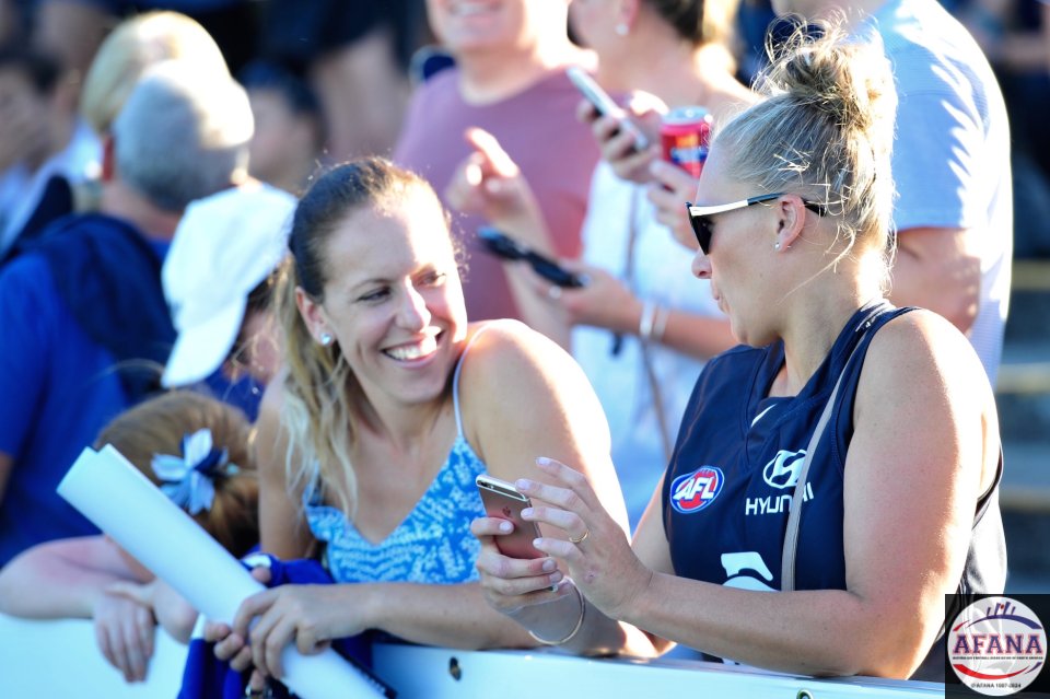 Carlton supporters enjoying the balmy Melbourne weather at the first AFLW match between the Blues and the Pies