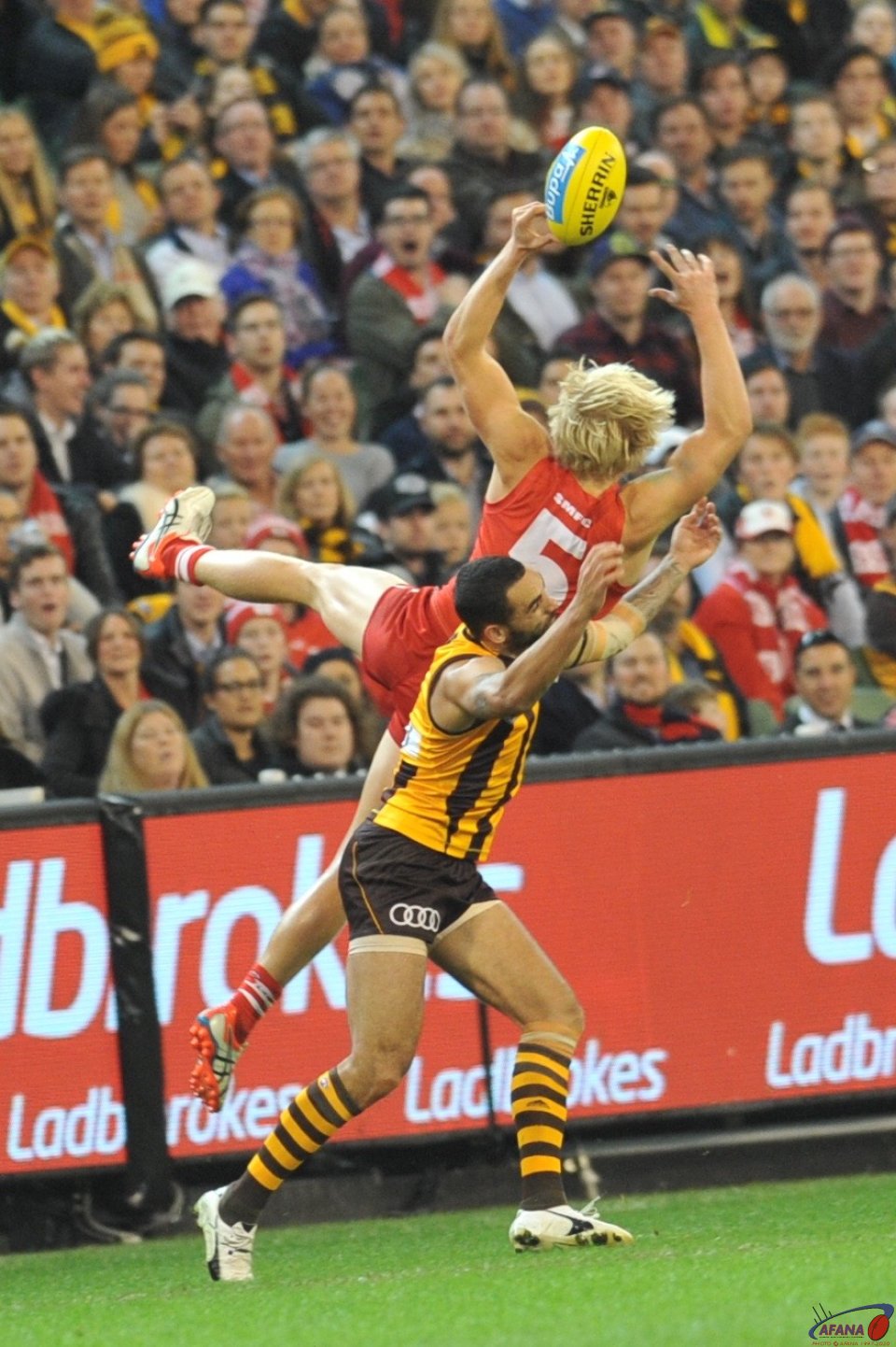 Heeney wins a free kick afetr Burgoyne clumsy tunnelling