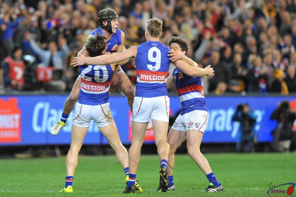 Dunkley, Daniel, Stringer and Liberatore celebrate after the siren