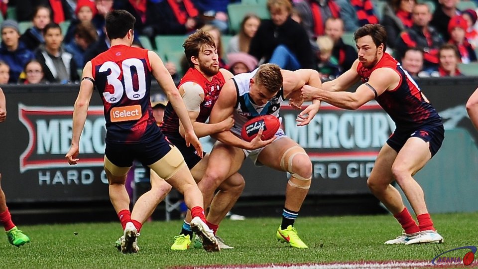 Jack Viney and Michael Hibberd tackle Robbie Gray