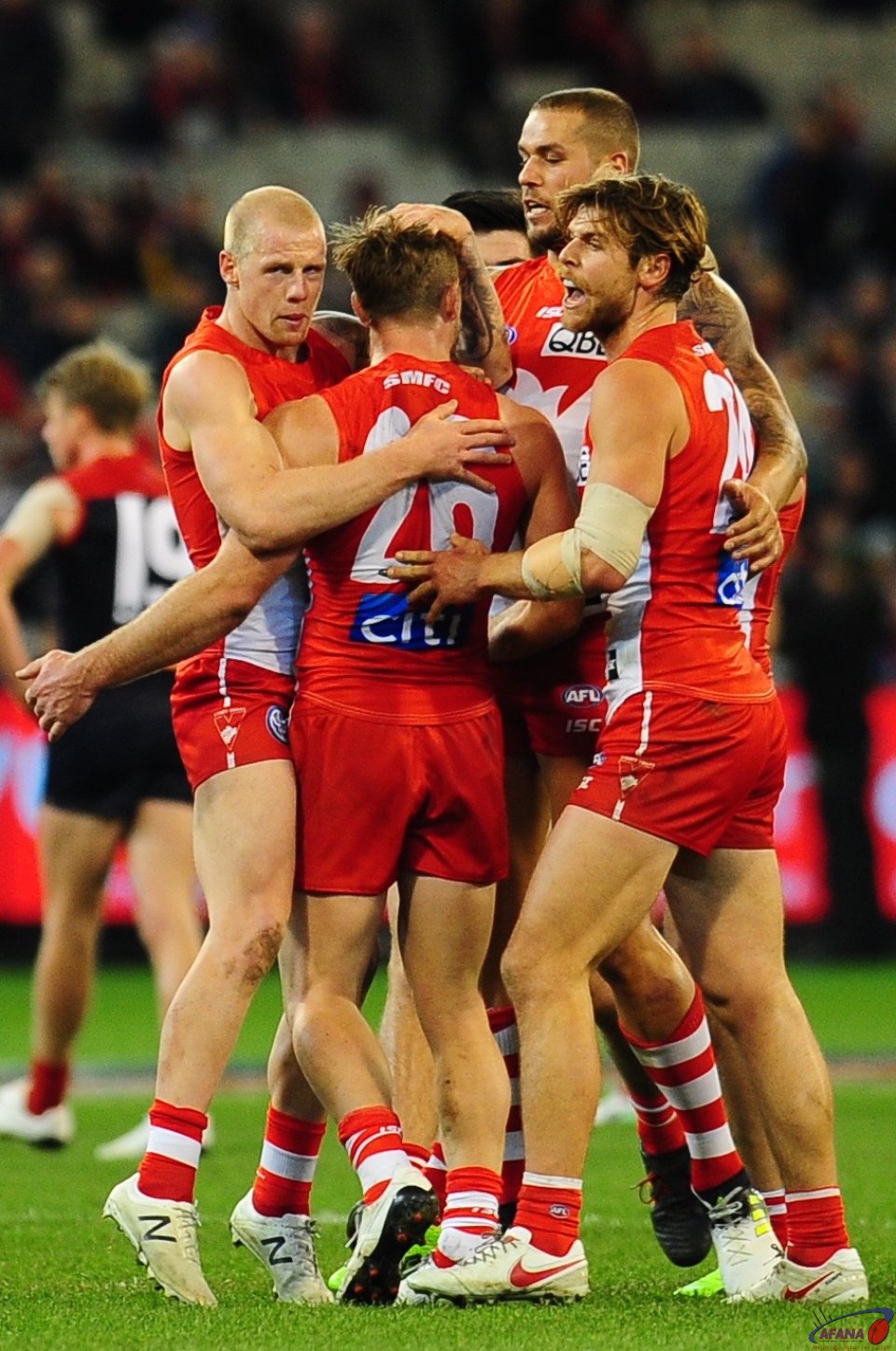 Luke Parker is mobbed by his team mates