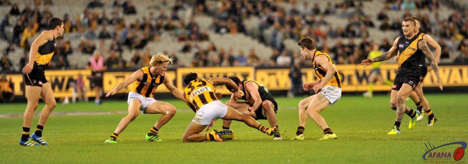 Furious attack on the ball by Cyril Rioli 