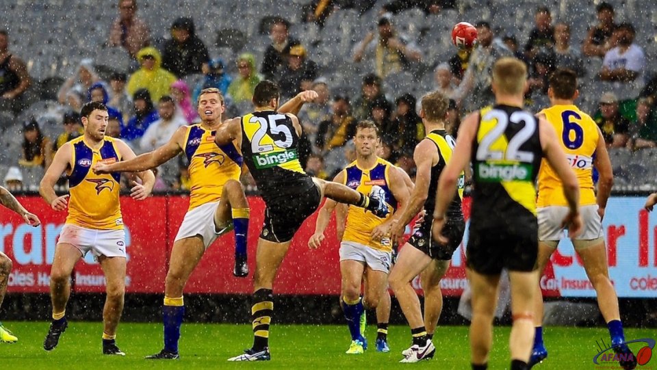 Pouring rain drenches the centre ball up as Vardy and Nankervies contest (25)